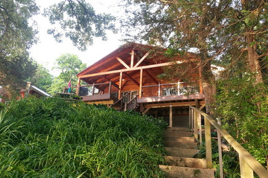 Example of a deck design in Milwaukee with a roof extension