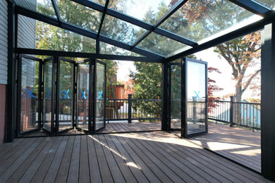 Large minimalist sunroom photo in New York