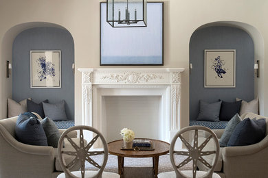 Example of a classic formal carpeted and beige floor living room design in San Francisco with beige walls, a standard fireplace and a plaster fireplace