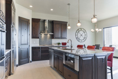 Inspiration for a large contemporary u-shaped ceramic tile eat-in kitchen remodel in Salt Lake City with dark wood cabinets, white backsplash, stainless steel appliances, an island, a double-bowl sink, raised-panel cabinets, granite countertops and mosaic tile backsplash