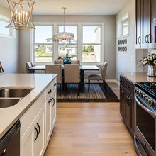 Wooden floor w/dark cabinets and trim