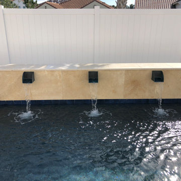 Modern Pool with Water Scuppers in Apopka, Florida