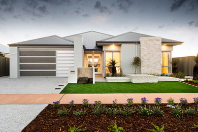 Photo of a contemporary one-storey grey exterior in Perth with stone veneer.