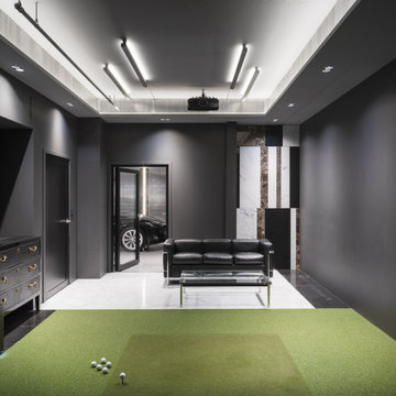 View of golf simulator space in this reenvisioned garage unit.