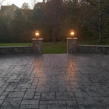 T-Stamped concrete patio, flagstone wall with columns
