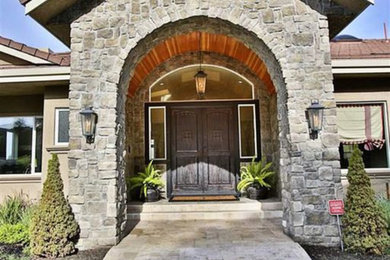 Inspiration for a huge mediterranean travertine floor and beige floor entryway remodel in San Francisco