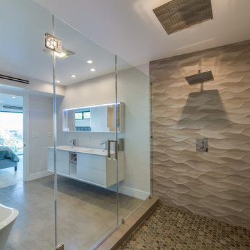 Wave Tile Shower with Dual Rain Heads Beside the Soaking Tub