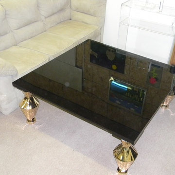 Coffee Table - Black Lucite slab on custom brass legs