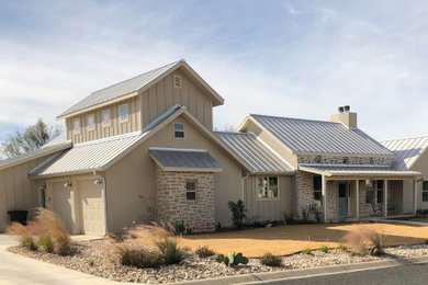 Large craftsman multicolored two-story mixed siding exterior home idea in Austin with a metal roof