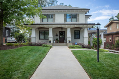 Design ideas for a large traditional partial sun front yard concrete paver landscaping in Other.