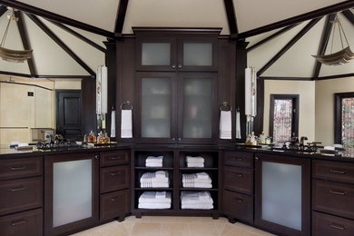 This is an example of a transitional master bathroom in Detroit with granite benchtops.