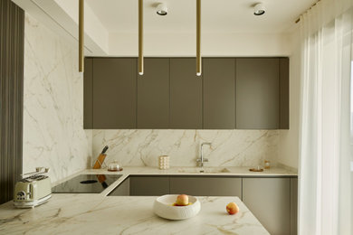 Inspiration for a large contemporary u-shaped kitchen remodel in Milan with tile countertops and a peninsula