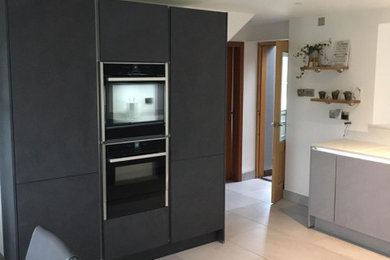 This is an example of a medium sized contemporary kitchen in Belfast.