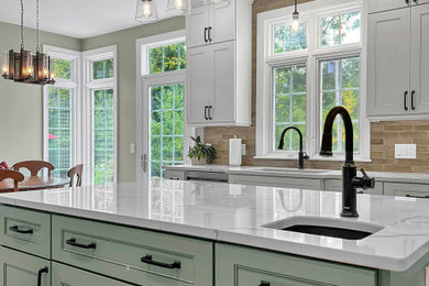 Mid-sized trendy vinyl floor kitchen photo in New York with an undermount sink, shaker cabinets, green cabinets, quartz countertops, green backsplash, porcelain backsplash, stainless steel appliances, an island and white countertops