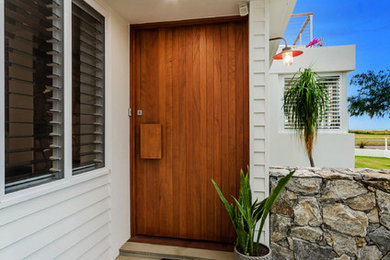 Photo of a beach style entryway in Townsville.
