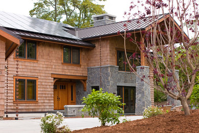 Large elegant two-story mixed siding gable roof photo in Seattle