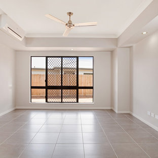 Home theater - mid-sized modern enclosed home theater idea in Cairns