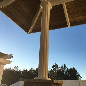 Outdoor Bar with Exposed Rafter Roofing & Paver Seating