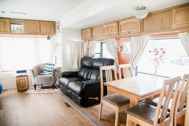 Inspiration for a small eclectic open concept family room remodel in San Diego with orange walls and a concealed tv