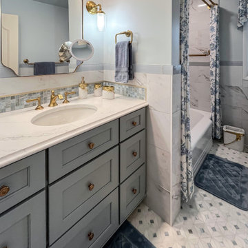 Blue and White Guest Bathroom with Gold Accents