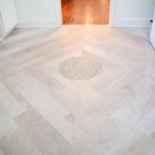 Medium sized modern galley utility room in Baltimore with an utility sink, flat-panel cabinets, white cabinets, glass worktops, multi-coloured walls, porcelain flooring, a side by side washer and dryer, grey floors and green worktops.