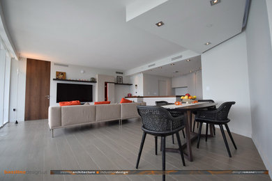 Example of a mid-sized trendy formal and open concept porcelain tile living room design in Miami with gray walls, no fireplace and a wall-mounted tv
