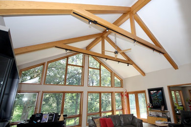 Example of a mid-sized arts and crafts open concept carpeted family room design in Other with a standard fireplace, a brick fireplace, a music area, white walls and a tv stand