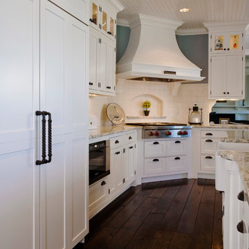White Brookhaven Recessed Panel Cabinets with White Ceramic Tile Backsplash