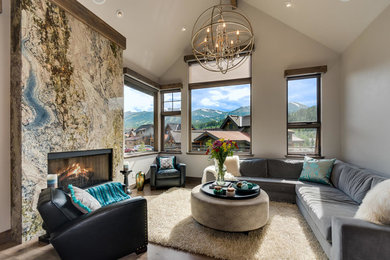 Inspiration for a mid-sized contemporary open concept dark wood floor and brown floor living room remodel in Denver with beige walls, a standard fireplace and a tile fireplace