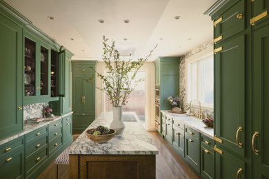 Inspiration for a timeless galley medium tone wood floor and brown floor eat-in kitchen remodel in San Francisco with an undermount sink, green cabinets, marble countertops, marble backsplash, paneled appliances, an island, recessed-panel cabinets, multicolored backsplash and multicolored countertops