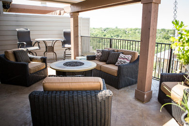 Inspiration for a mid-sized timeless backyard tile patio remodel in Austin with a fire pit and a pergola