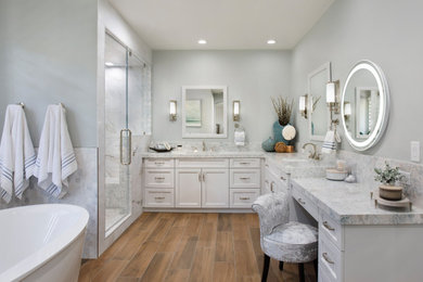 Example of a huge beach style master marble tile double-sink bathroom design in Orange County with shaker cabinets, a one-piece toilet, an undermount sink, quartz countertops, blue countertops and a built-in vanity