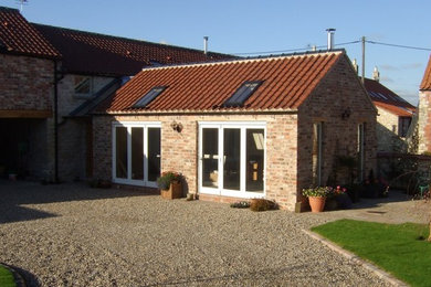 Design ideas for a farmhouse house exterior in Other.