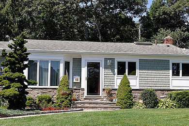 Mid-sized traditional beige one-story wood exterior home idea in New York
