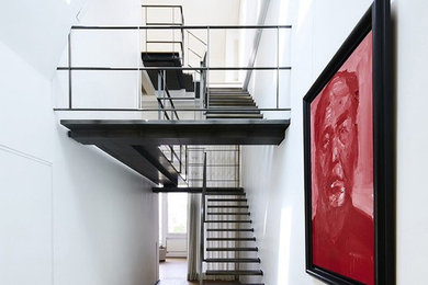 Trendy u-shaped open staircase photo in New York