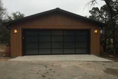 Inspiration for a large timeless detached two-car garage remodel in Austin