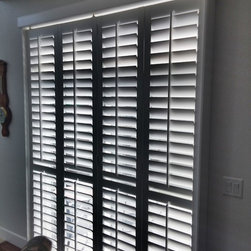 Crestview Shutters using large Deco frame and bi-fold track shutters - Interior Shutters