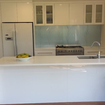 Corian Benchtops with Dezignatek White Gloss cabinetry