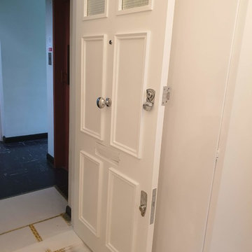 Water damage repair painting work with front door replace in Putney