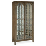 Hooker Furniture - Sundance Display Cabinet - Create a calming resort-inspired retreat in your home with the focal-point-worthy Sundance Display Cabinet. The circular patterned metal fretwork over tempered glass on the door fronts is a designer detail, along with an antique mirror back panel. Behind the doors are 4 adjustable wood-framed glass shelves illuminated by a 3-intensity touch switch. Crafted of Pecan Veneers, the cabinet is finished in Cliffside, a rich, dynamic brown finish with light burnishing on the edges.