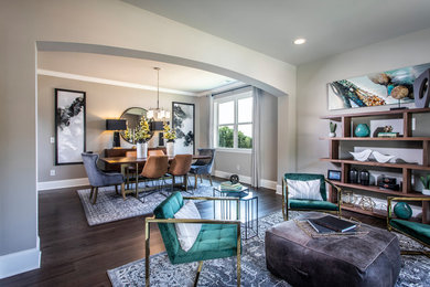 Example of a mid-sized trendy open concept dark wood floor and brown floor living room design in Atlanta with gray walls, no fireplace and no tv