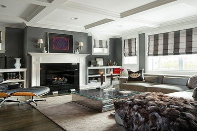 Inspiration for a large transitional enclosed living room in Chicago with grey walls, dark hardwood floors, a standard fireplace, a wood fireplace surround, no tv and brown floor.