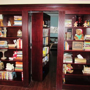 Design ideas for a large classic fully buried basement in DC Metro with multi-coloured walls, laminate floors and brown floors.