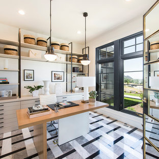 Design ideas for a medium sized modern study in Boston with white walls, no fireplace, a freestanding desk and multi-coloured floors.