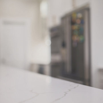 Kitchen remodel in Jessup, MD with glossy, modern, white kitchen countertop