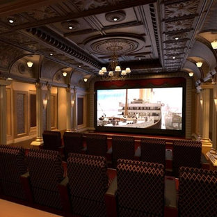 Large victorian enclosed home cinema in Oklahoma City with beige walls and a wall mounted tv.