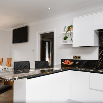 The stunning Orinoco granite shines from every angle in this modern kitchen.