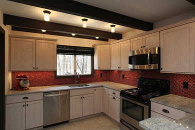 Kitchen - transitional ceramic tile kitchen idea in New York with an undermount sink, shaker cabinets, light wood cabinets, granite countertops, red backsplash, ceramic backsplash and stainless steel appliances