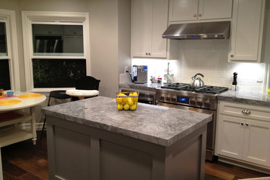 This is an example of an arts and crafts kitchen in Orange County with granite benchtops.