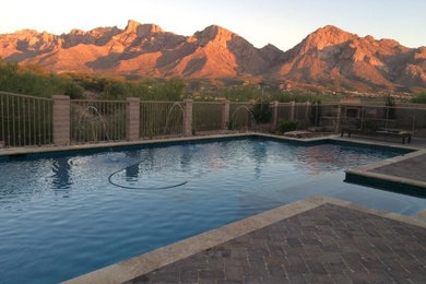 Large trendy backyard stone and rectangular natural pool fountain photo in Phoenix